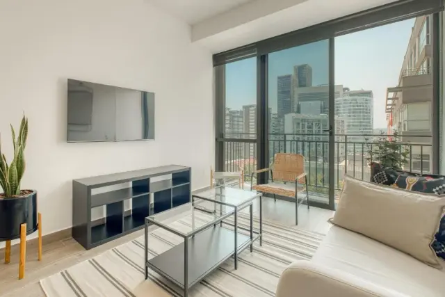One-Bedroom Apartment with Balcony and City View