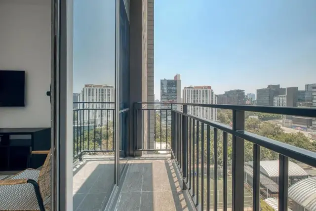 One-Bedroom Apartment with Balcony and City View