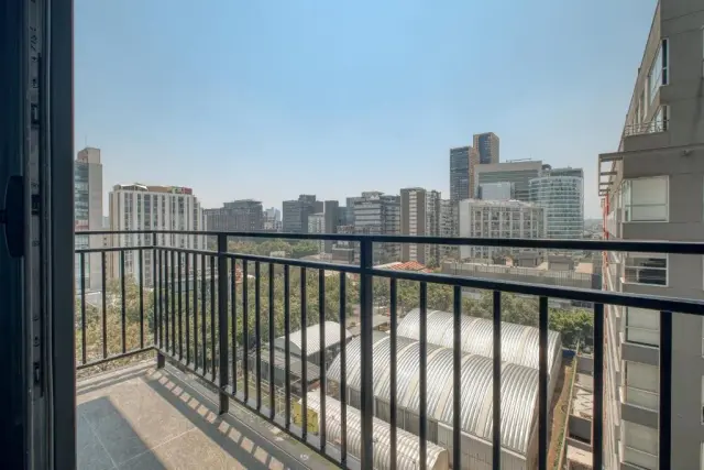 One-Bedroom Apartment with Balcony and City View